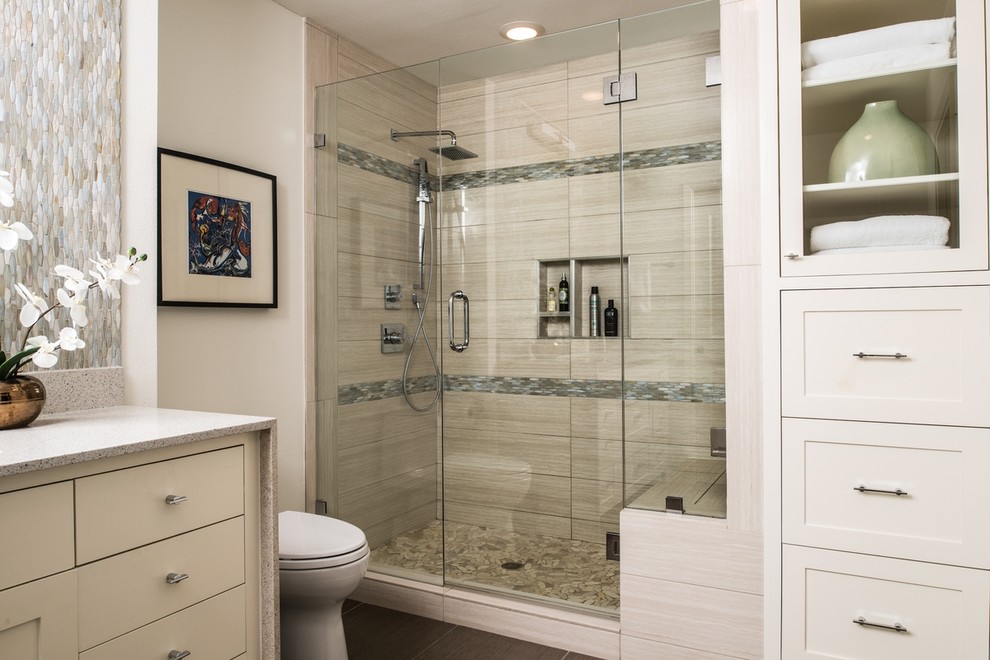 This is an example of a medium sized modern ensuite bathroom in Austin with a submerged sink, flat-panel cabinets, white cabinets, engineered stone worktops, a walk-in shower, a one-piece toilet, grey tiles, porcelain tiles, white walls and porcelain flooring.