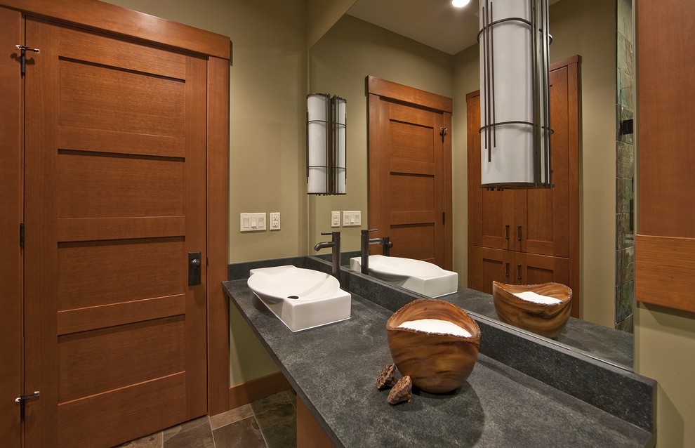 Inspiration for a mid-sized contemporary 3/4 slate floor bathroom remodel in Seattle with a vessel sink, recessed-panel cabinets, medium tone wood cabinets, soapstone countertops and green walls