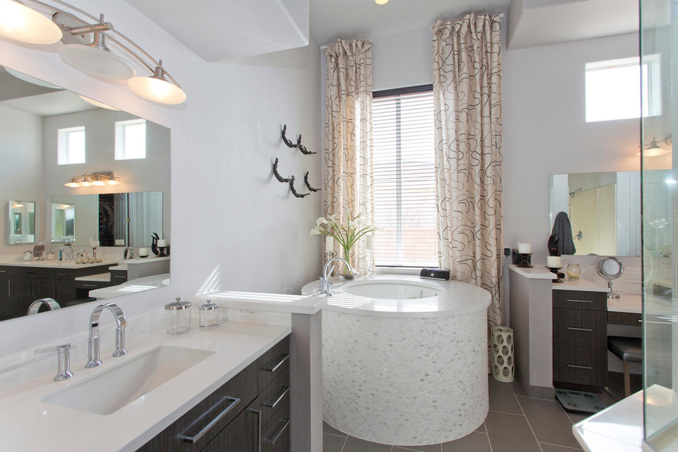 Example of a trendy bathroom design in Las Vegas with dark wood cabinets