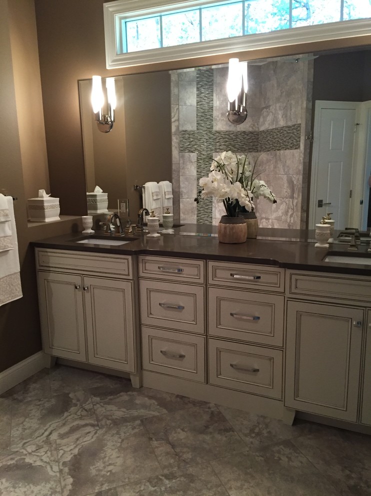 Example of a mid-sized transitional master beige tile and ceramic tile ceramic tile alcove shower design in Other with an undermount sink, quartz countertops, brown walls, furniture-like cabinets and white cabinets