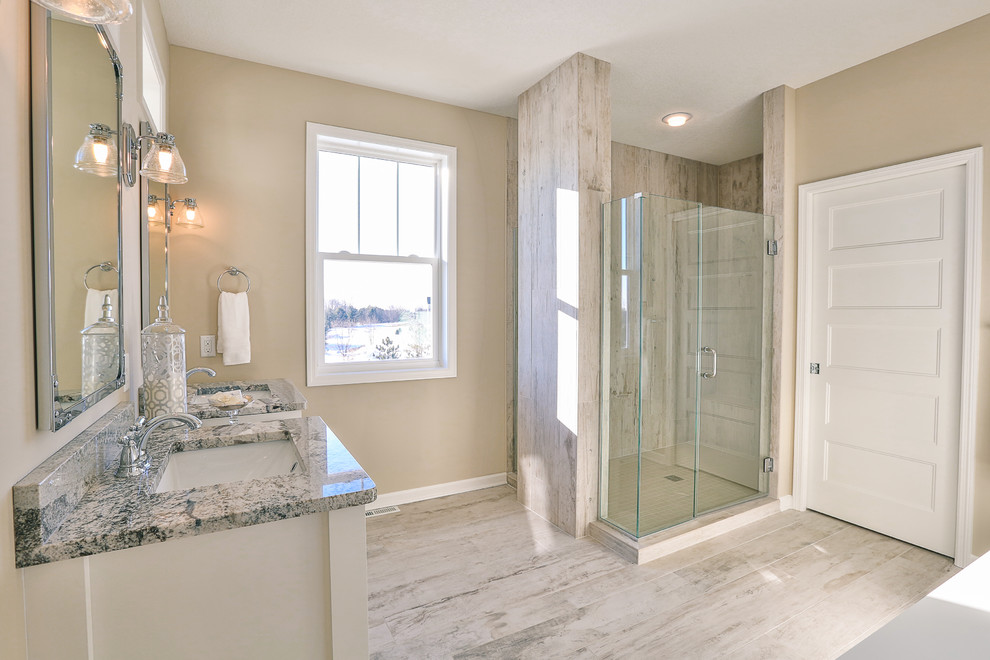 Double shower - mid-sized contemporary master ceramic tile ceramic tile double shower idea in Minneapolis with an undermount sink, beaded inset cabinets, white cabinets, marble countertops, a one-piece toilet and beige walls