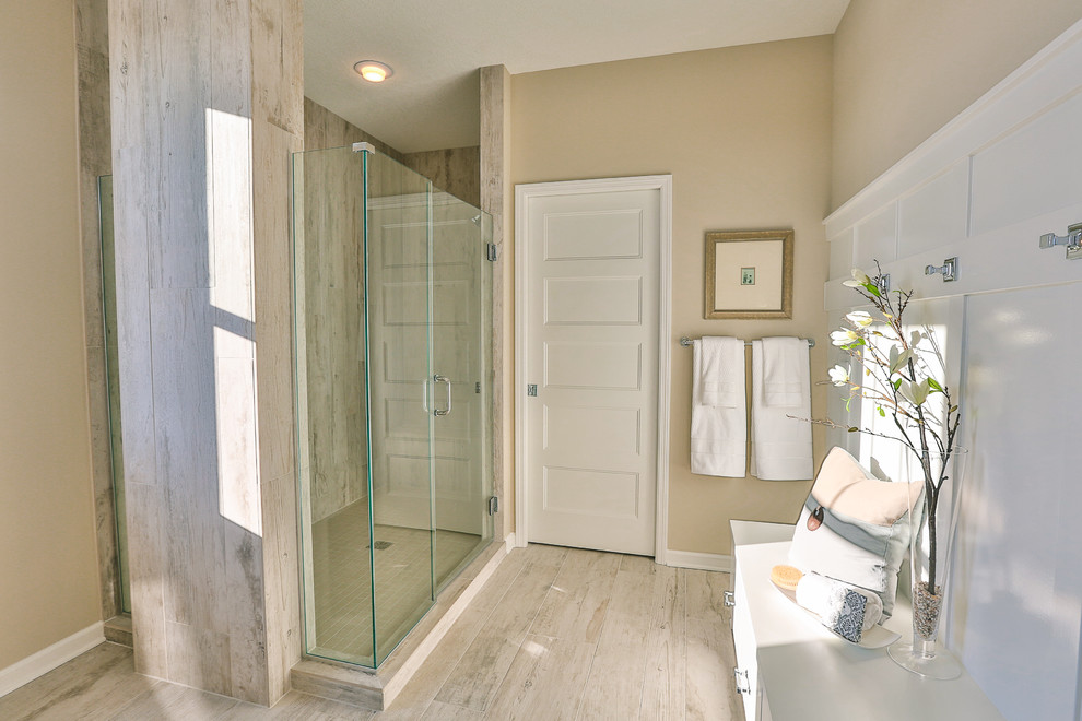 Inspiration for a mid-sized contemporary master ceramic tile ceramic tile double shower remodel in Minneapolis with an undermount sink, beaded inset cabinets, white cabinets, marble countertops, a one-piece toilet and beige walls