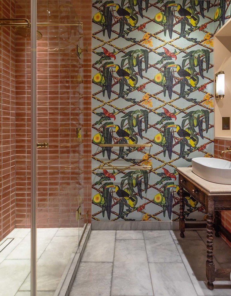 Alcove shower - mid-sized eclectic master pink tile and ceramic tile marble floor and gray floor alcove shower idea in London with dark wood cabinets, multicolored walls, a vessel sink, marble countertops, a hinged shower door and beige countertops