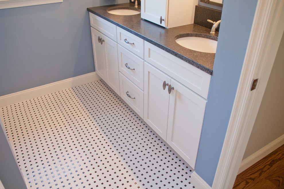 Bathroom - mid-sized transitional kids' white tile and ceramic tile ceramic tile bathroom idea in Philadelphia with an undermount sink, shaker cabinets, white cabinets, granite countertops, a two-piece toilet and blue walls