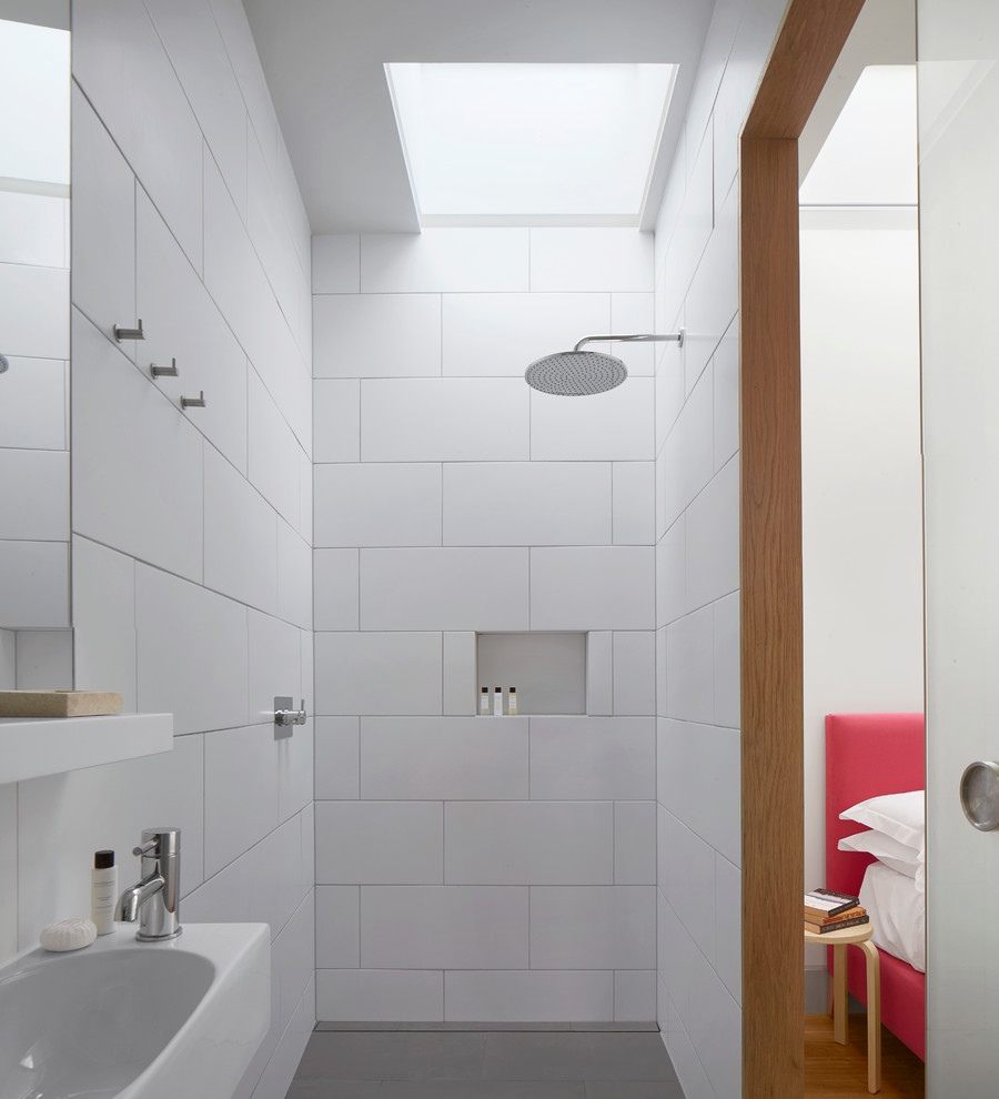 This is an example of a contemporary half tiled bathroom in London.