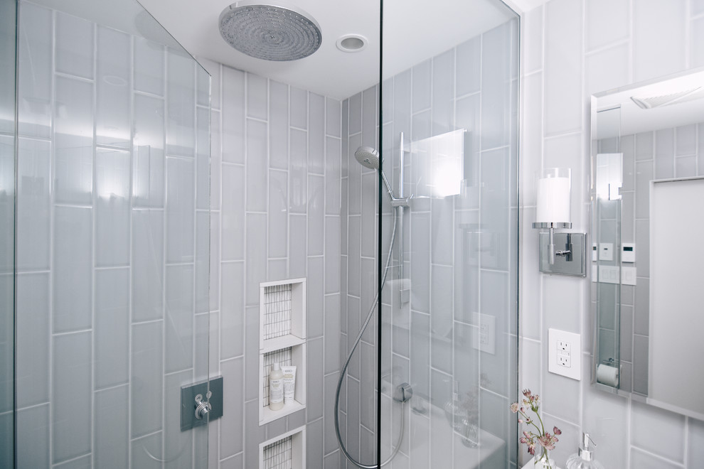 Small trendy master gray tile and ceramic tile walk-in shower photo in Montreal with white cabinets, a hinged shower door, furniture-like cabinets, gray walls, an integrated sink, quartz countertops and white countertops
