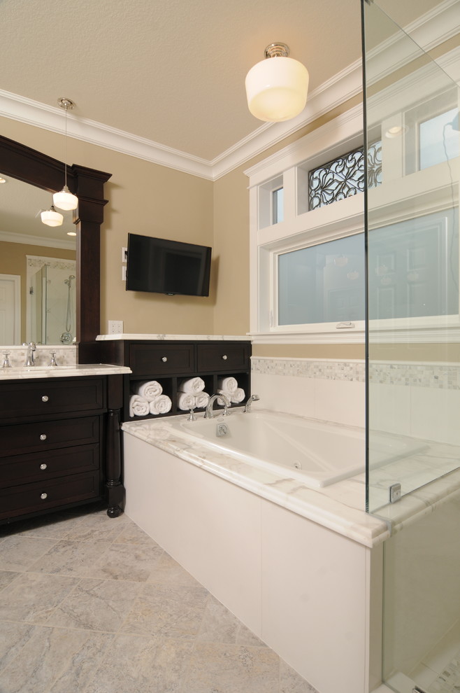 Inspiration for a classic ensuite bathroom in Seattle with marble worktops, shaker cabinets, dark wood cabinets, a hot tub, an alcove shower, grey tiles, white tiles, stone tiles, beige walls, porcelain flooring and a submerged sink.