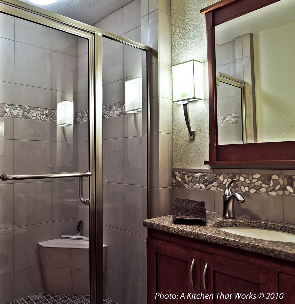 This is an example of a small classic shower room bathroom in Seattle with a submerged sink, shaker cabinets, dark wood cabinets, engineered stone worktops, an alcove shower, a two-piece toilet, beige tiles, porcelain tiles, white walls, porcelain flooring, a hinged door, a shower bench, a single sink and a built in vanity unit.