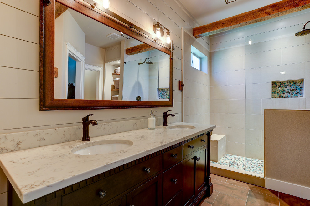 Bathroom - large craftsman master brown tile ceramic tile, gray floor, double-sink, exposed beam and wood wall bathroom idea in Other with dark wood cabinets, a one-piece toilet, brown walls, an undermount sink, white countertops and a freestanding vanity