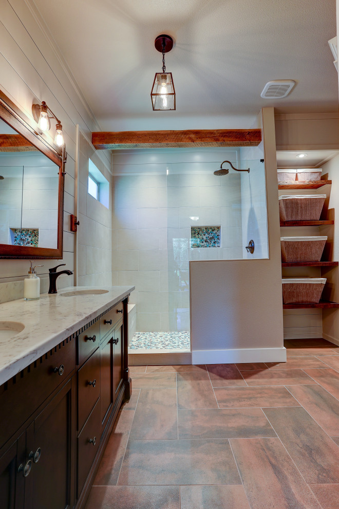 Large traditional ensuite bathroom in Other with dark wood cabinets, a walk-in shower, a one-piece toilet, brown tiles, brown walls, ceramic flooring, a submerged sink, grey floors, an open shower, white worktops, double sinks, a freestanding vanity unit, exposed beams and wood walls.