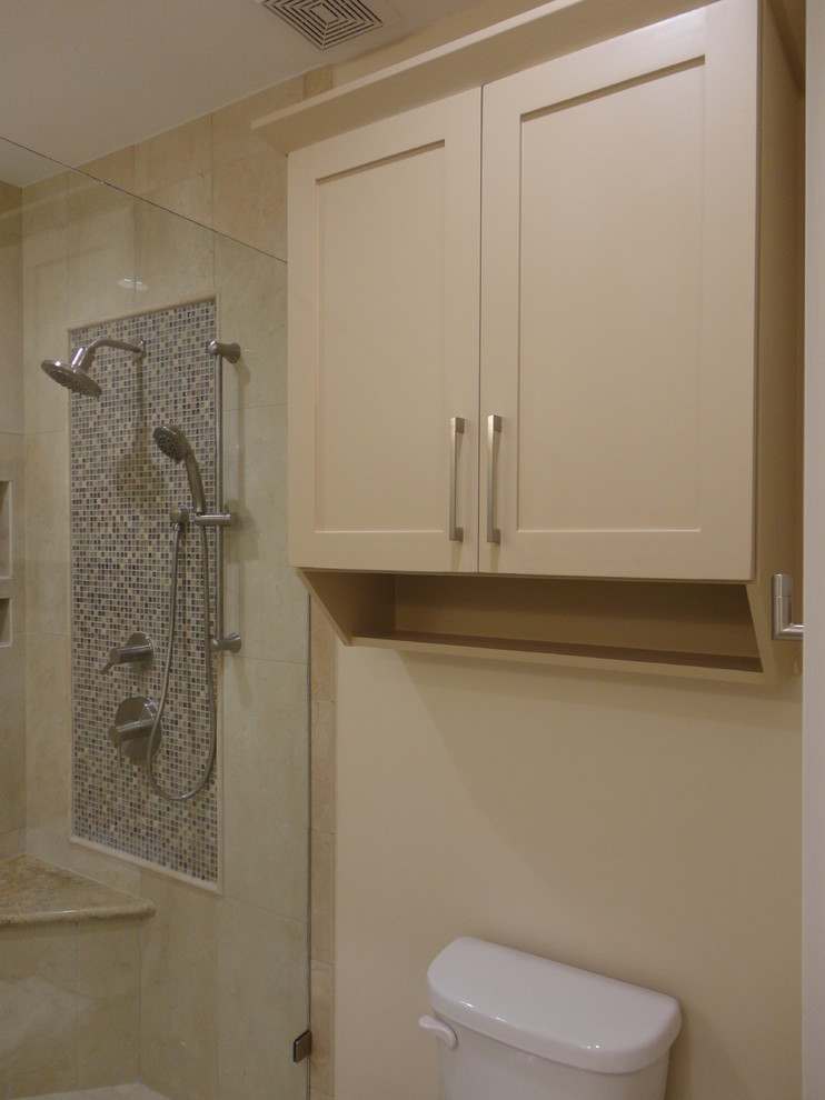 This is an example of a medium sized contemporary ensuite bathroom in Houston with shaker cabinets, brown cabinets, a corner shower, a two-piece toilet, beige tiles, mosaic tiles, brown walls, travertine flooring, a submerged sink and granite worktops.