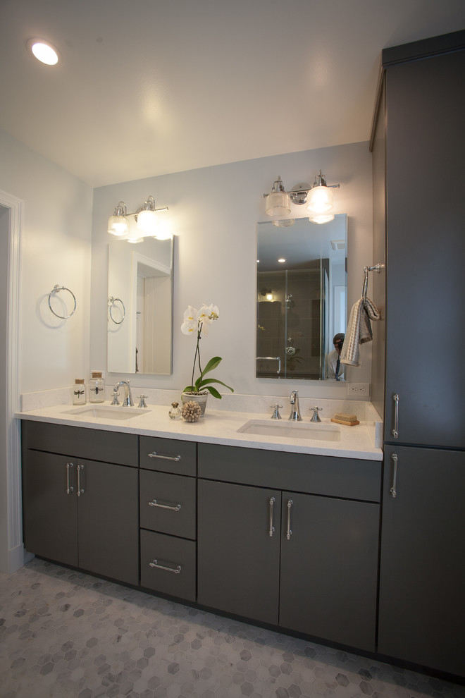 Example of a mid-sized trendy master black tile and porcelain tile mosaic tile floor and white floor corner shower design in DC Metro with flat-panel cabinets, dark wood cabinets, a two-piece toilet, gray walls, an undermount sink, quartz countertops, a hinged shower door and white countertops