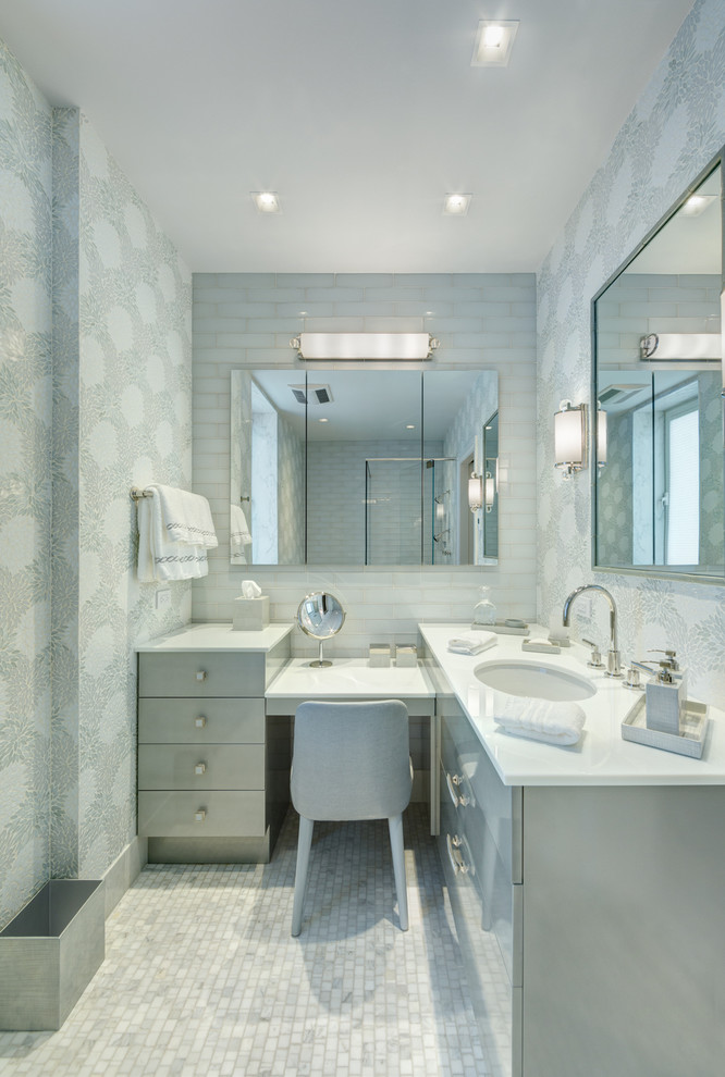 Design ideas for a large traditional ensuite bathroom in New York with flat-panel cabinets, grey cabinets, a corner shower, a two-piece toilet, grey tiles, white tiles, mosaic tiles, grey walls, mosaic tile flooring, a submerged sink and quartz worktops.