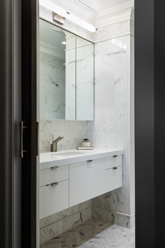 Inspiration for a small classic ensuite bathroom in New York with white cabinets, a walk-in shower, white tiles, stone tiles, white walls, marble flooring, an integrated sink, marble worktops, white floors and a hinged door.
