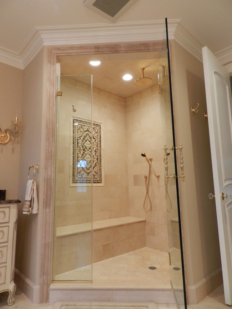 Example of a classic beige tile and stone tile bathroom design in Chicago with an undermount sink, raised-panel cabinets, beige cabinets, marble countertops and a two-piece toilet