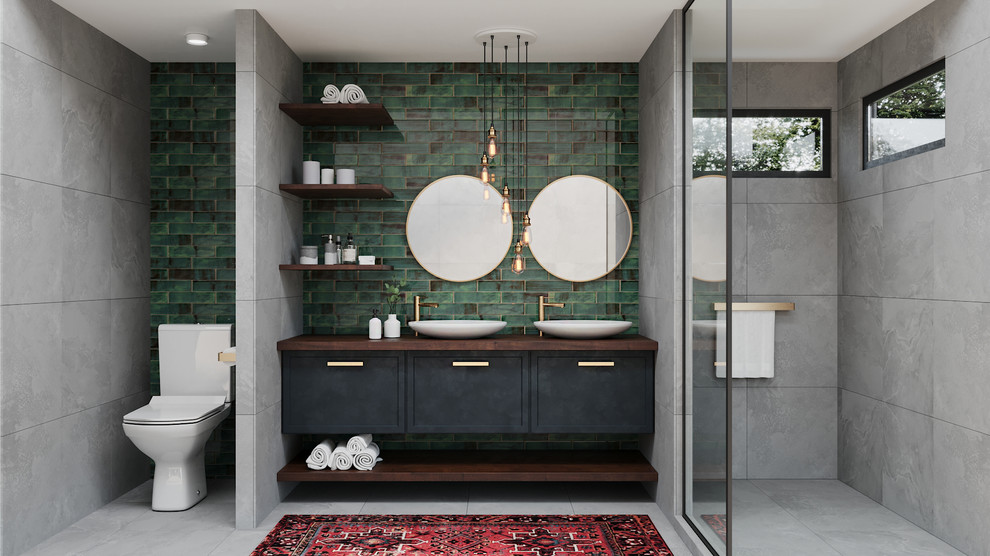Inspiration for a medium sized modern ensuite bathroom in Austin with flat-panel cabinets, blue cabinets, a walk-in shower, a one-piece toilet, grey tiles, glass tiles, green walls, ceramic flooring, a vessel sink, wooden worktops, grey floors, an open shower and brown worktops.