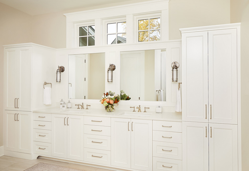 Inspiration for a timeless master ceramic tile, beige floor and double-sink bathroom remodel in Grand Rapids with shaker cabinets, white cabinets, beige walls, an undermount sink, quartz countertops, white countertops and a built-in vanity