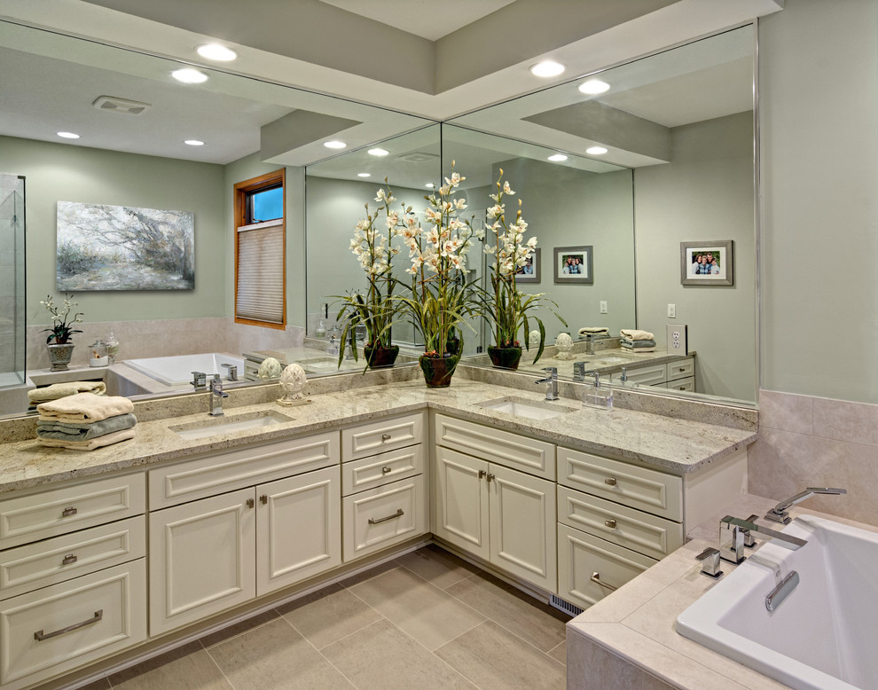 Example of a mid-sized classic master beige tile and porcelain tile porcelain tile bathroom design in Minneapolis with recessed-panel cabinets, white cabinets, a two-piece toilet, gray walls, an undermount sink and granite countertops