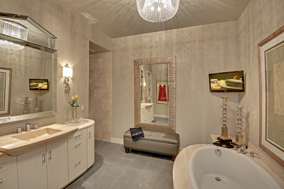 Пример оригинального дизайна: ванная комната в стиле неоклассика (современная классика) с монолитной раковиной, плоскими фасадами, бежевыми фасадами, накладной ванной и бежевой плиткой