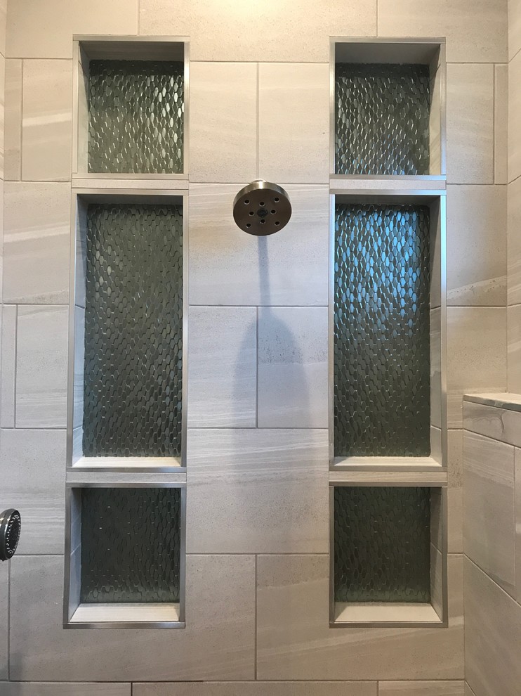 Example of a mid-sized minimalist master gray tile and porcelain tile porcelain tile and gray floor bathroom design in Other with flat-panel cabinets, gray cabinets, gray walls, an undermount sink, solid surface countertops, a hinged shower door and white countertops