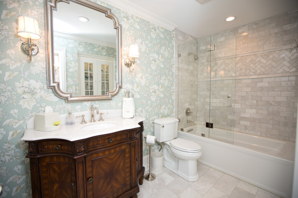 Inspiration for a mid-sized timeless 3/4 marble floor and gray floor bathroom remodel in Chicago with furniture-like cabinets, dark wood cabinets, a two-piece toilet, multicolored walls, an undermount sink, quartzite countertops and white countertops