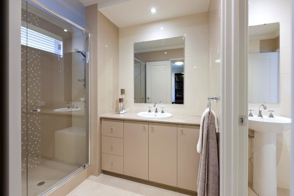 Large modern ensuite bathroom in Perth with flat-panel cabinets, beige cabinets, a double shower, a one-piece toilet, beige tiles, ceramic tiles, brown walls, ceramic flooring, a built-in sink, laminate worktops, beige floors, a hinged door, beige worktops, an enclosed toilet, a single sink and a built in vanity unit.