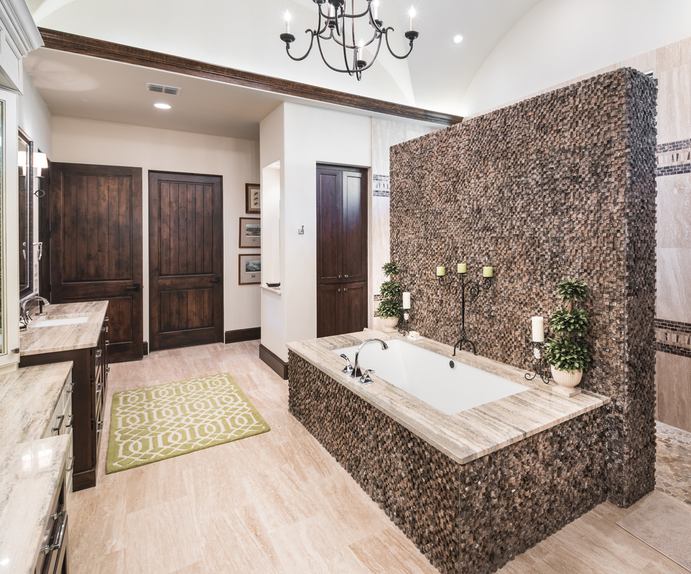 Inspiration for a large mediterranean ensuite bathroom in Austin with dark wood cabinets, a built-in bath, white walls, vinyl flooring, a built-in sink, granite worktops and beige floors.
