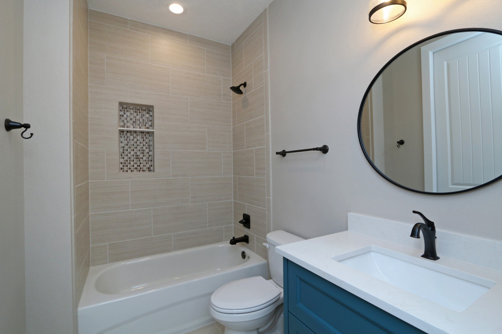 Inspiration for a large timeless kids' beige tile and ceramic tile ceramic tile, beige floor and double-sink bathroom remodel in Orlando with recessed-panel cabinets, turquoise cabinets, a one-piece toilet, beige walls, an undermount sink, quartz countertops, white countertops and a built-in vanity