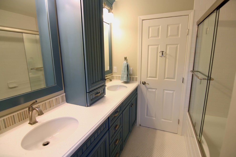 Inspiration for a mid-sized transitional 3/4 mosaic tile floor and white floor bathroom remodel in Detroit with beaded inset cabinets, blue cabinets, white walls and solid surface countertops