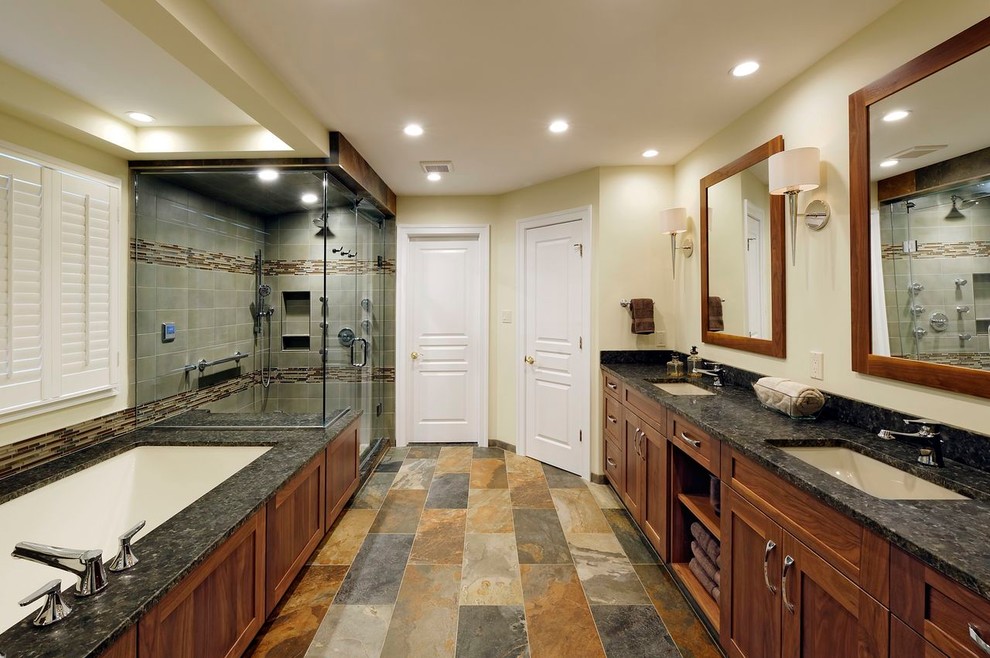 Example of a transitional multicolored tile and porcelain tile bathroom design in DC Metro with an undermount sink, flat-panel cabinets, medium tone wood cabinets, granite countertops and an undermount tub