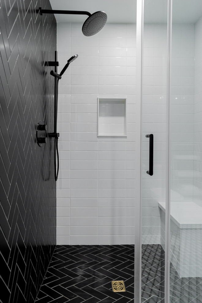 Medium sized traditional ensuite bathroom in Toronto with flat-panel cabinets, medium wood cabinets, a freestanding bath, an alcove shower, a one-piece toilet, black and white tiles, porcelain tiles, blue walls, marble flooring, a submerged sink, engineered stone worktops, white floors, a hinged door and white worktops.