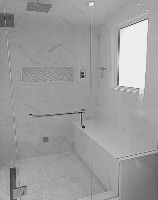 Inspiration for a large modern master white tile and stone slab marble floor bathroom remodel in Toronto with flat-panel cabinets, dark wood cabinets, a one-piece toilet, gray walls, a drop-in sink and solid surface countertops