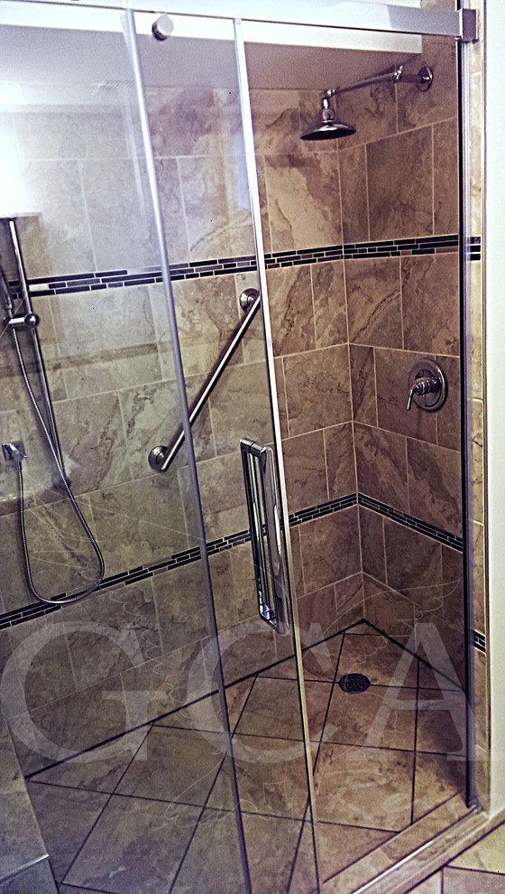 This is an example of a large contemporary shower room bathroom in Toronto with a submerged sink, a double shower, a two-piece toilet, multi-coloured tiles, ceramic tiles, beige walls and ceramic flooring.