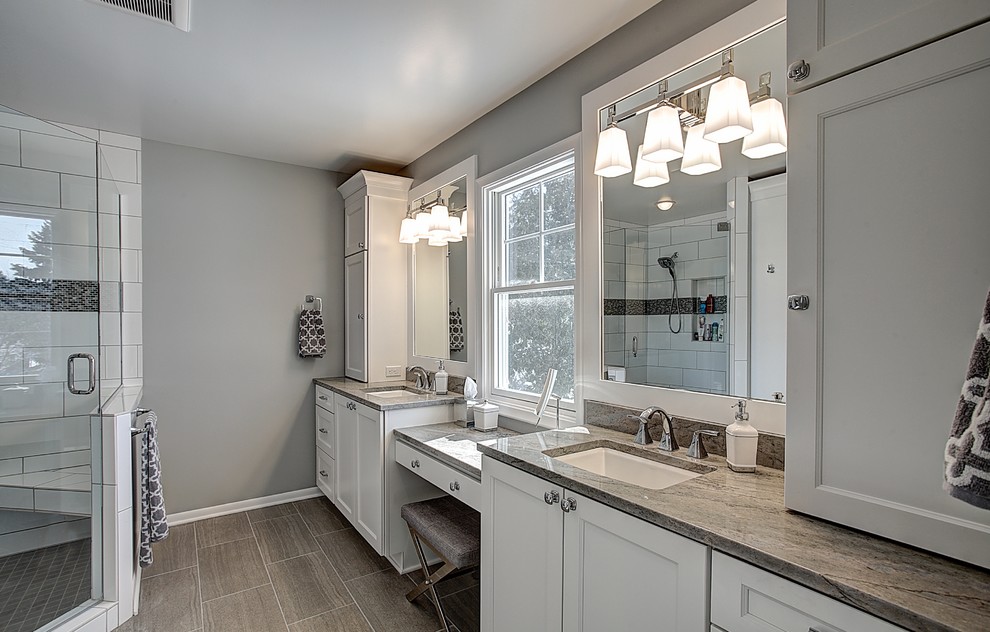 Large arts and crafts master gray tile and ceramic tile ceramic tile corner shower photo in Grand Rapids with an undermount sink, shaker cabinets, white cabinets, granite countertops, a two-piece toilet and gray walls