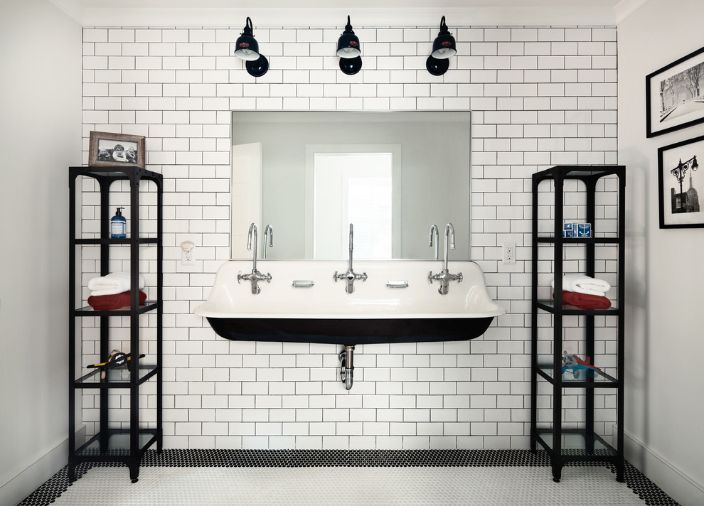 Classic family bathroom in New York with white tiles, metro tiles, white walls, mosaic tile flooring and a trough sink.