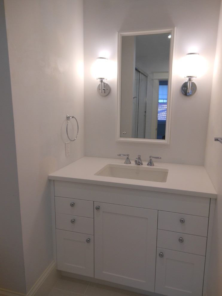 Bathroom - transitional white tile and porcelain tile bathroom idea in DC Metro with an undermount sink, shaker cabinets, white cabinets and quartz countertops
