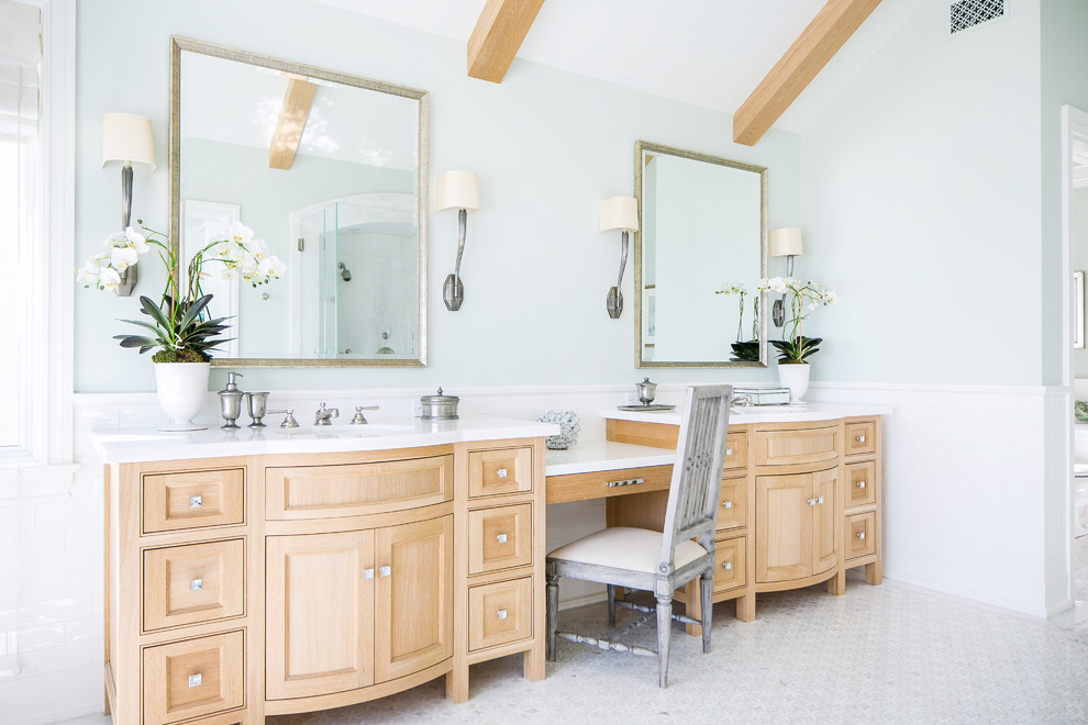 Bathroom - coastal white tile and subway tile marble floor and white floor bathroom idea in Orange County with beaded inset cabinets, medium tone wood cabinets, blue walls, an undermount sink and white countertops