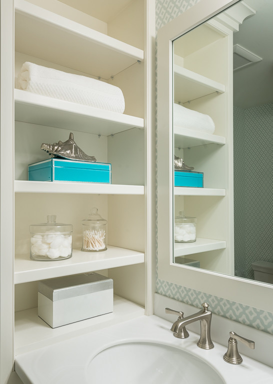Example of a small beach style white tile and porcelain tile porcelain tile alcove shower design in Wilmington with recessed-panel cabinets, white cabinets, an undermount sink and solid surface countertops