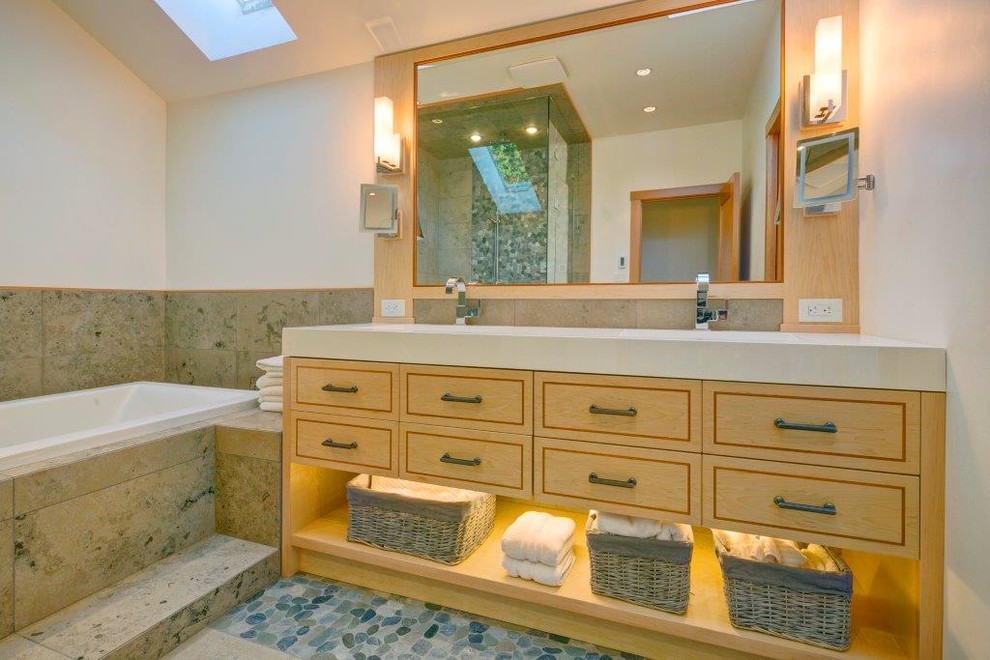 Example of a large arts and crafts master beige tile and ceramic tile ceramic tile bathroom design in Vancouver with raised-panel cabinets, light wood cabinets, white walls, an integrated sink and solid surface countertops
