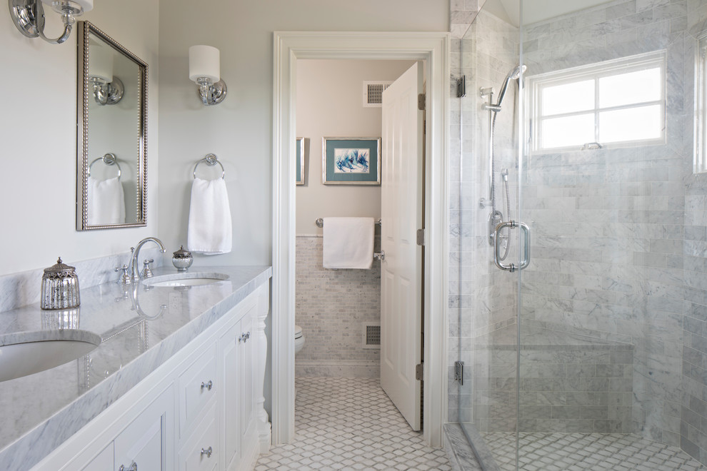 Inspiration for a mid-sized transitional master white tile and marble tile doorless shower remodel in New York with recessed-panel cabinets, white cabinets, a drop-in sink, marble countertops and a hinged shower door
