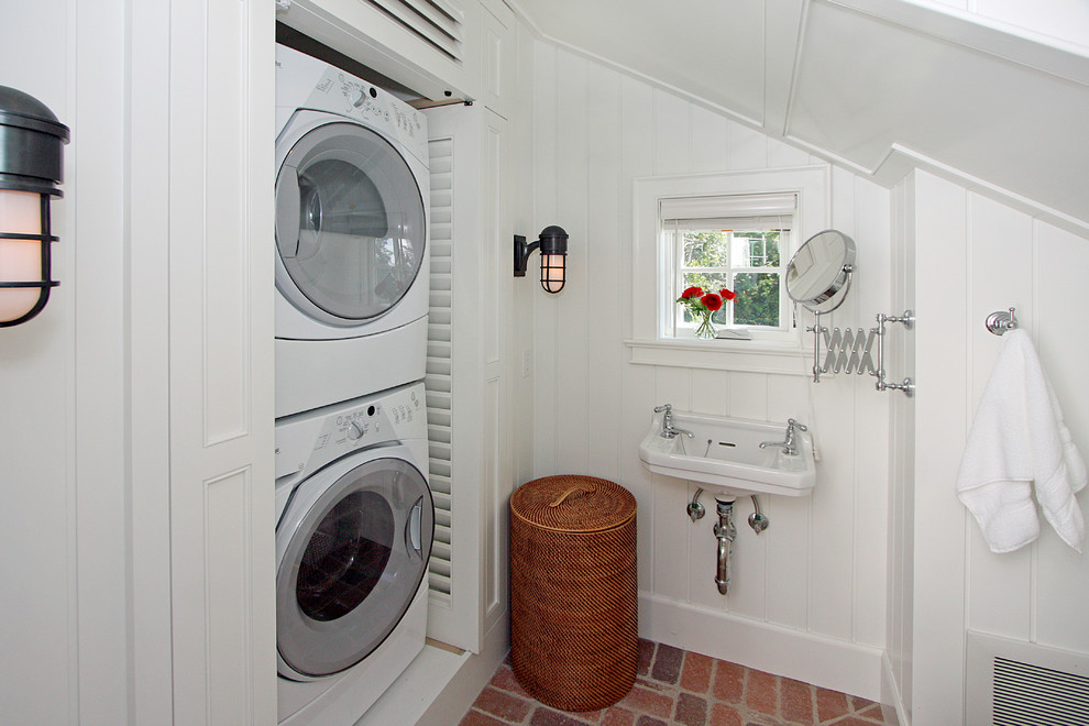 Inspiration for a coastal brick floor bathroom/laundry room remodel in Miami with white walls and a wall-mount sink