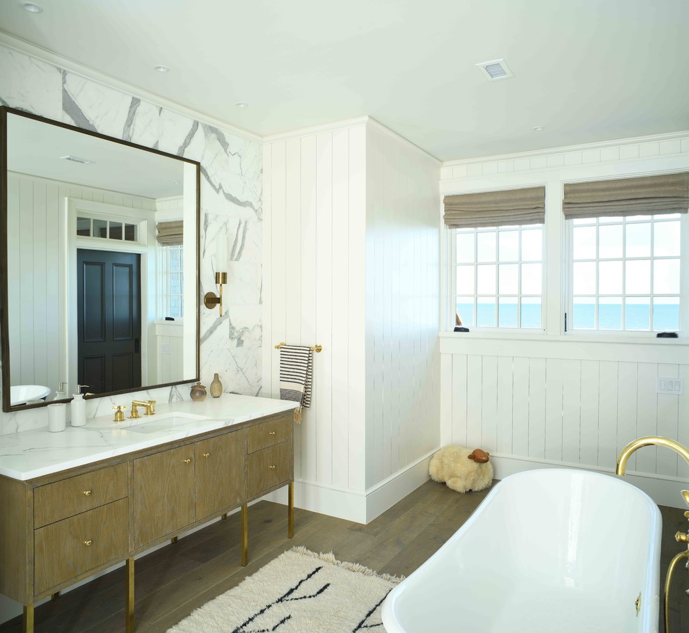 Bathroom - coastal master white tile and marble tile dark wood floor bathroom idea in Charleston with medium tone wood cabinets, white walls, an undermount sink, marble countertops, white countertops and flat-panel cabinets