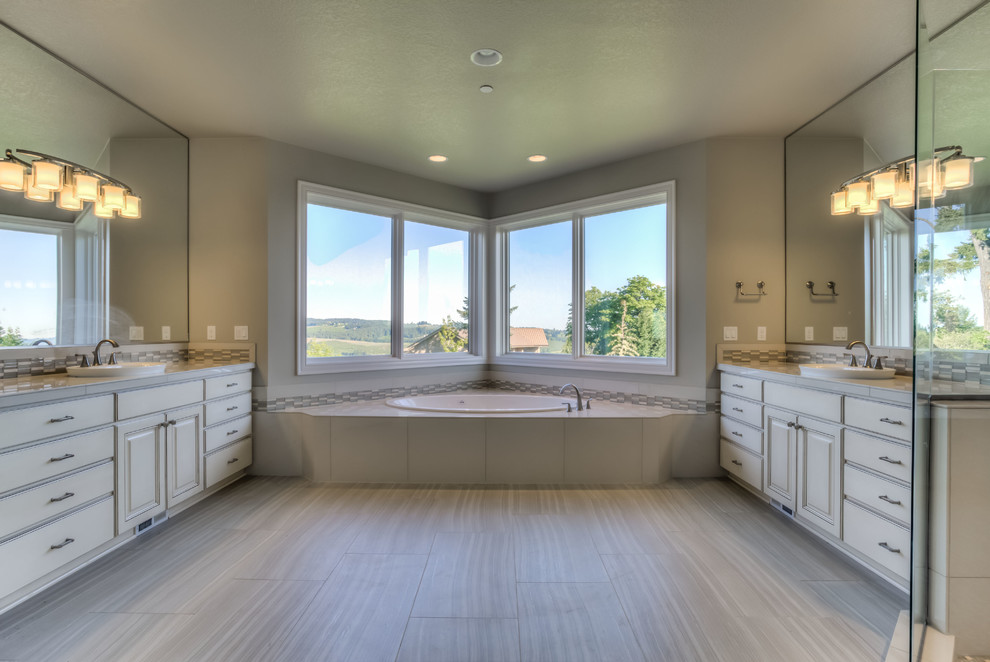 Example of a large arts and crafts master multicolored tile porcelain tile bathroom design in Portland with a vessel sink, shaker cabinets, beige cabinets, quartzite countertops and beige walls