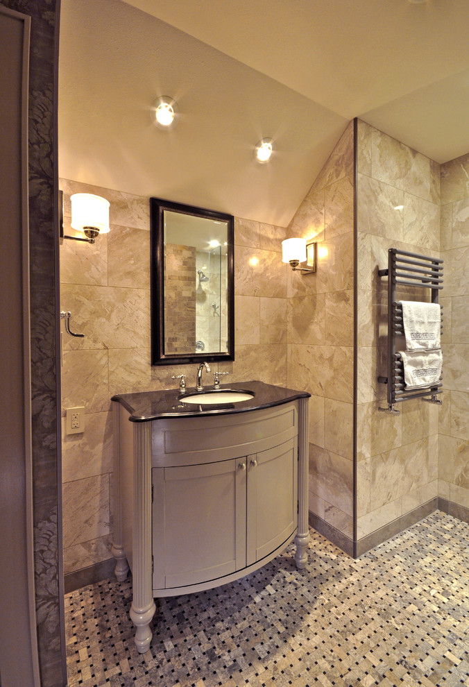 Photo of a medium sized traditional bathroom in Milwaukee with a submerged sink, freestanding cabinets, grey cabinets, granite worktops, a built-in shower, a two-piece toilet, beige tiles, stone tiles, beige walls and marble flooring.