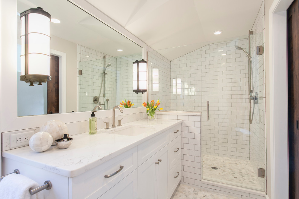 Design ideas for a medium sized classic ensuite bathroom in Bridgeport with shaker cabinets, white cabinets, white tiles, ceramic tiles, beige walls, ceramic flooring, a submerged sink and engineered stone worktops.