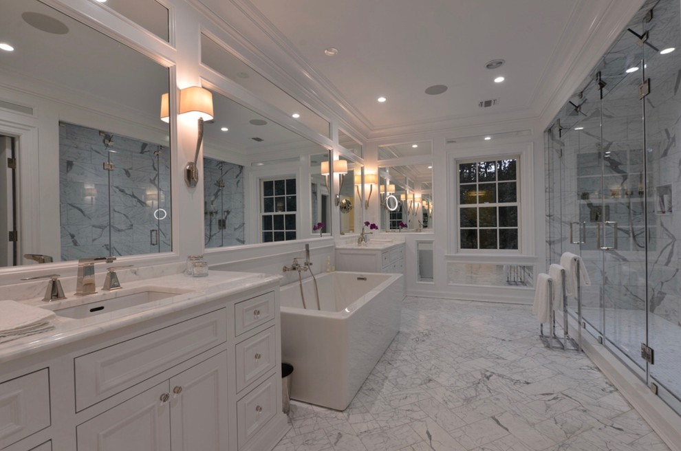 Example of a huge classic master marble floor and gray floor bathroom design in New York with beaded inset cabinets, white cabinets, multicolored walls, an undermount sink, marble countertops and a hinged shower door