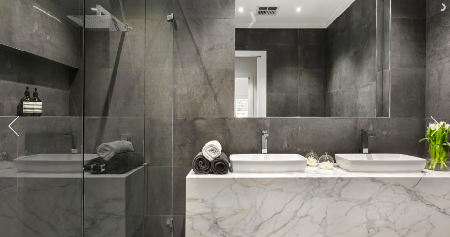 Inspiration for a mid-sized contemporary master gray tile and ceramic tile ceramic tile double shower remodel in Melbourne with flat-panel cabinets, gray cabinets, a one-piece toilet, gray walls, a drop-in sink and marble countertops