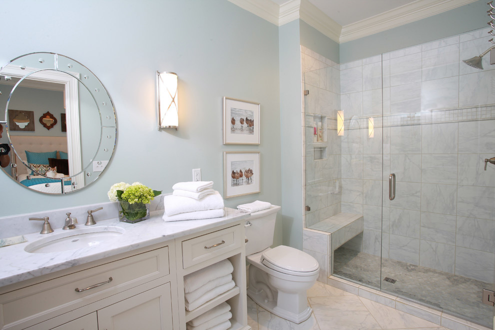 Wet room - mid-sized traditional master multicolored tile and mosaic tile marble floor wet room idea in Atlanta with flat-panel cabinets, beige walls, an undermount sink, granite countertops, a two-piece toilet, white cabinets and a hinged shower door