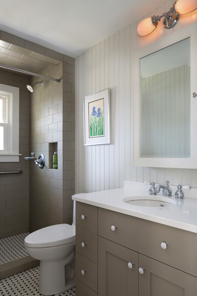 Example of a small transitional 3/4 brown tile and subway tile white floor bathroom design in Bridgeport with shaker cabinets, brown cabinets, a one-piece toilet, white walls, an undermount sink and quartzite countertops