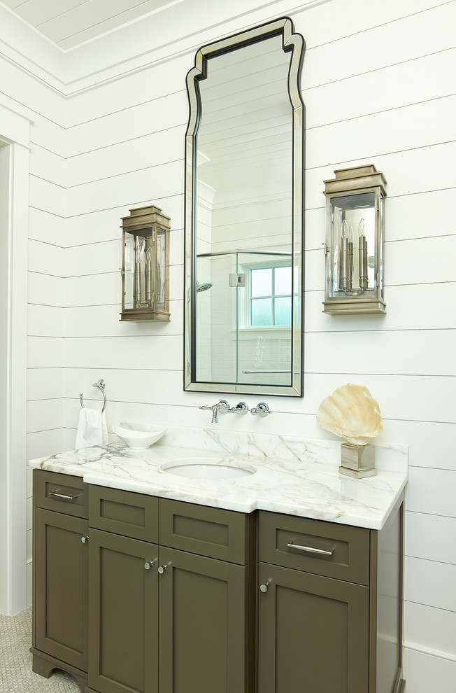 Bathroom - tropical bathroom idea in Charleston with shaker cabinets and marble countertops